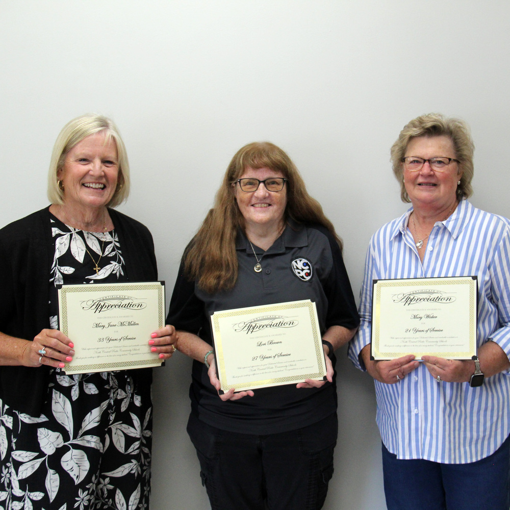 Photo of 3 women holding certificates.