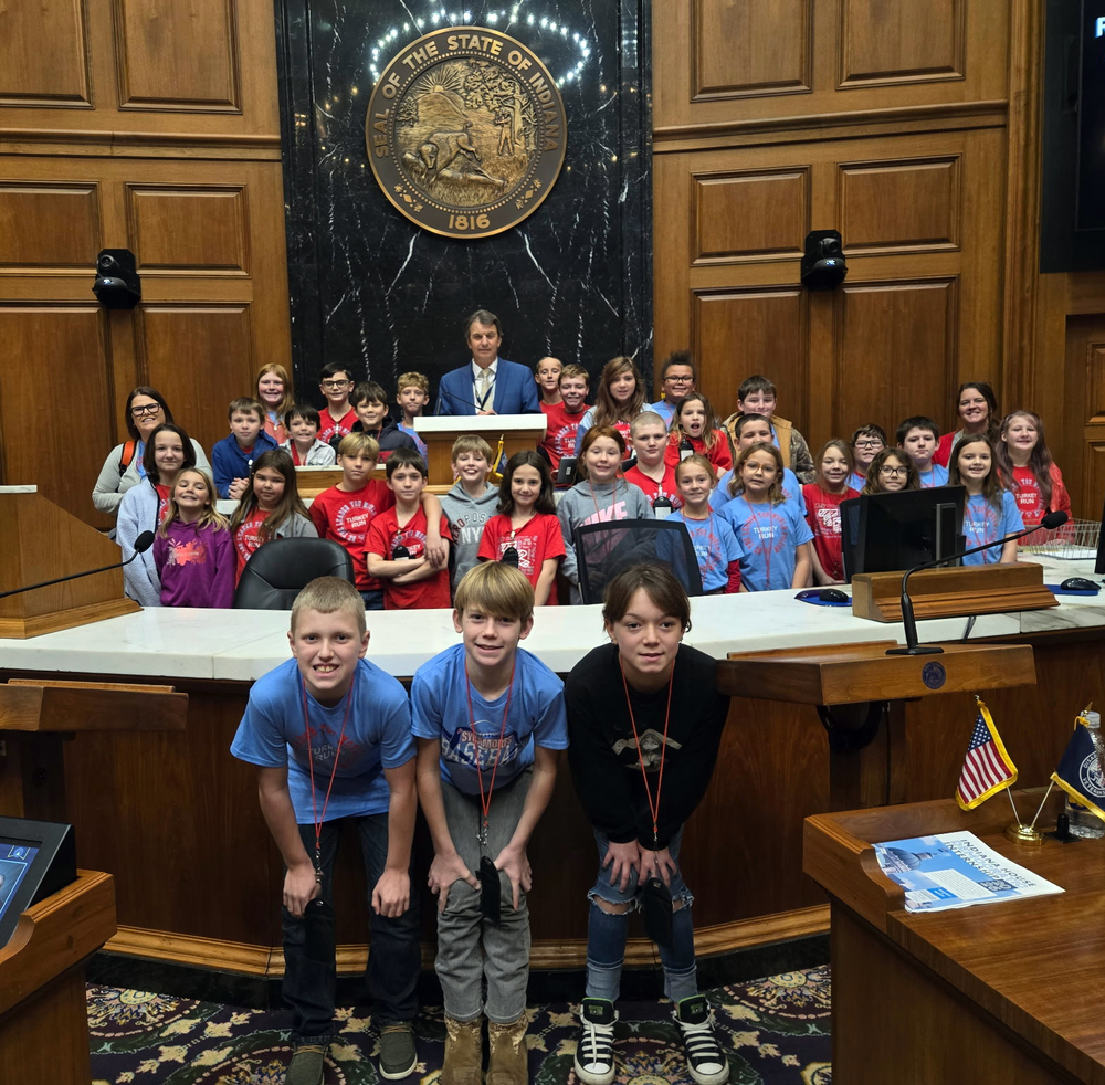 students standing in several rows with State Rep. Tim Yocum at the Statehouse