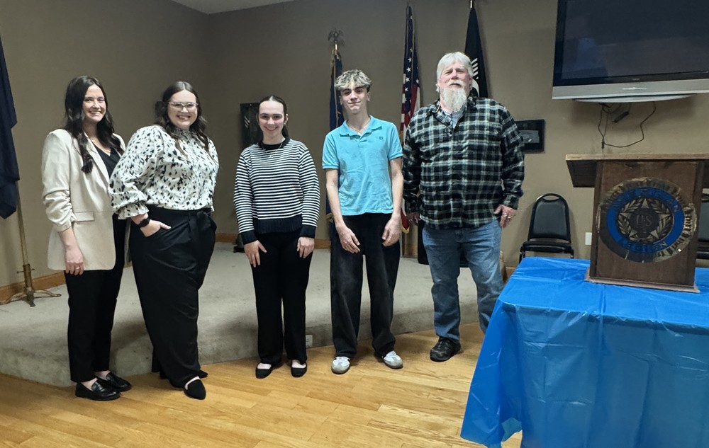 five people standing in a line