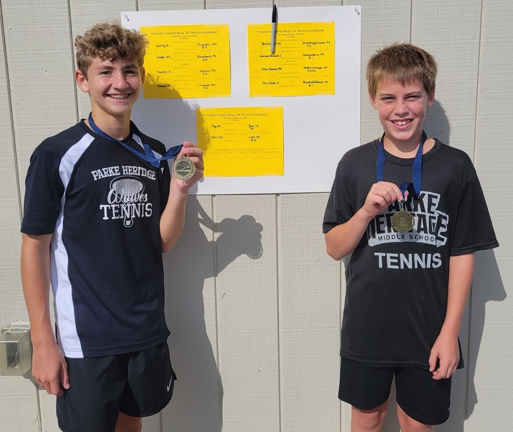 two boys wearing medals