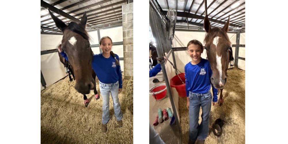 Two girls holding their horses