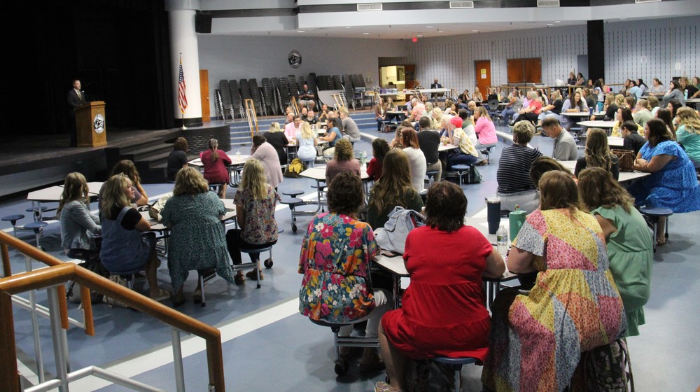 photo of staff members at the back to school meeting