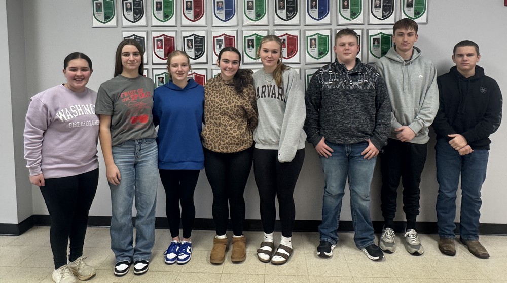 eight students standing in a line