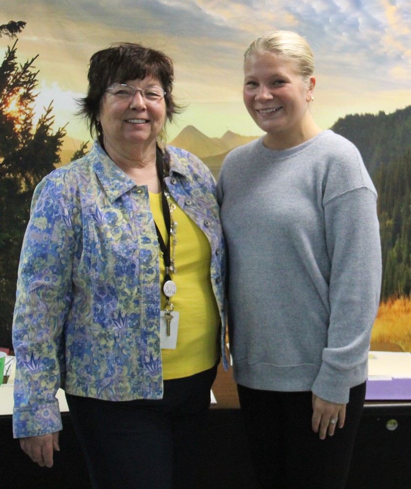 two women standing beside each other