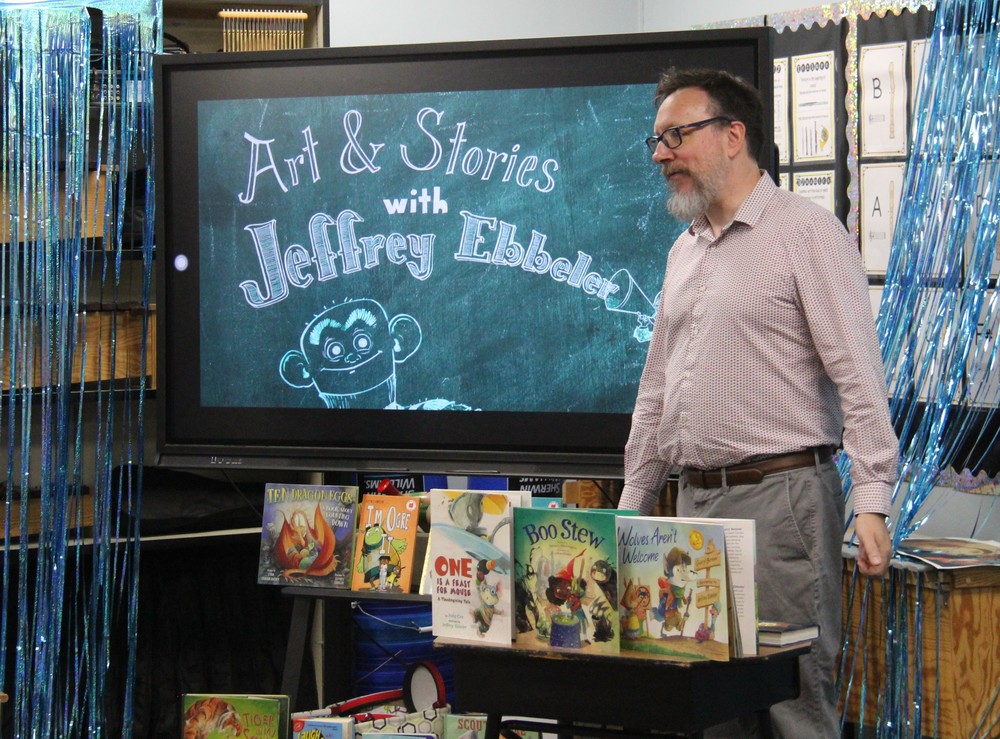 photo of a man with books