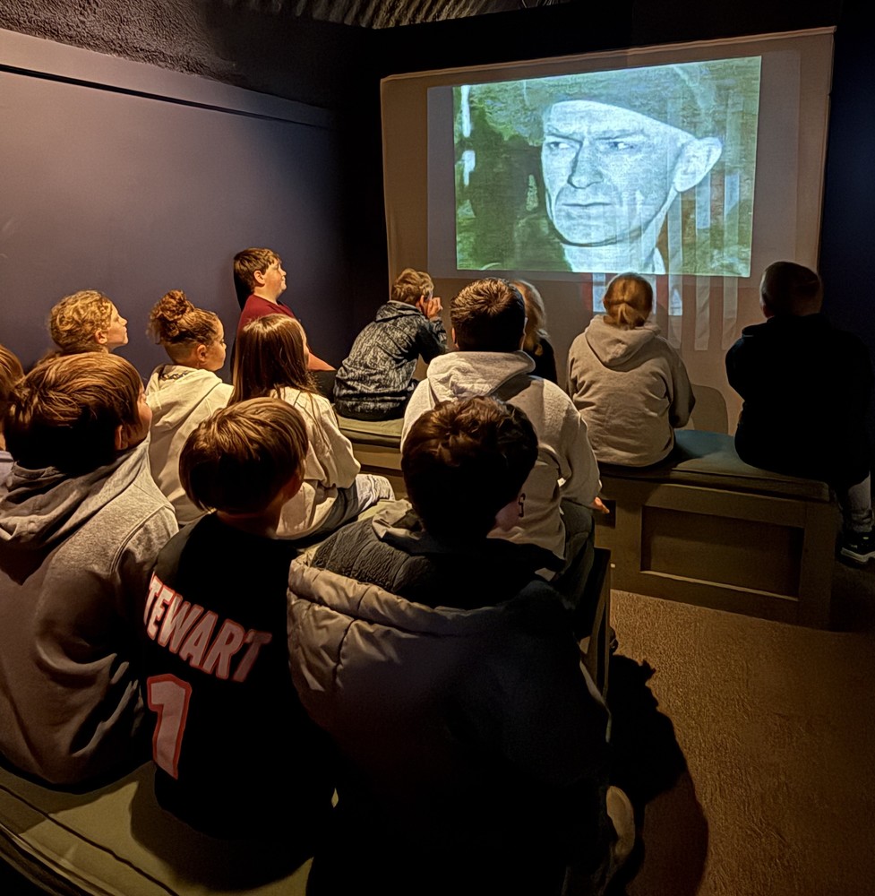 photo of students watching a video about Ernie Pyle