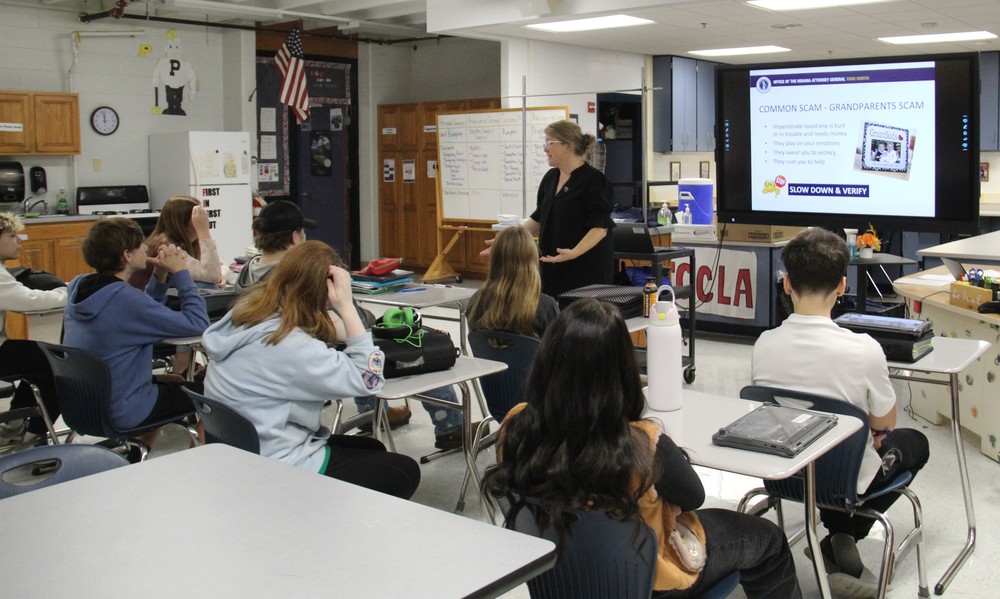 guest speaker talking to students sitting at their desks
