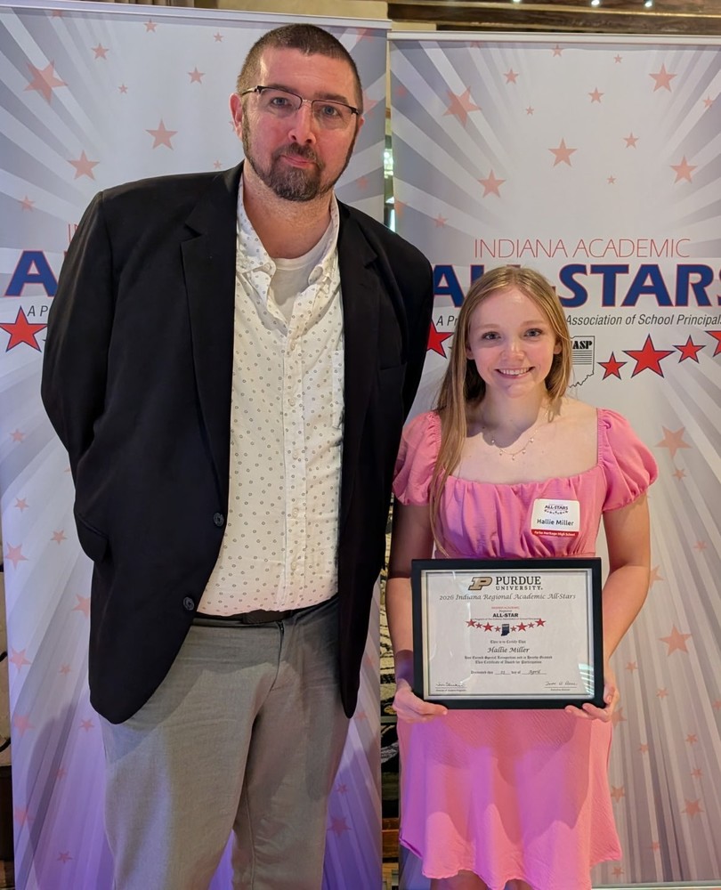 two people with one holding a certificate