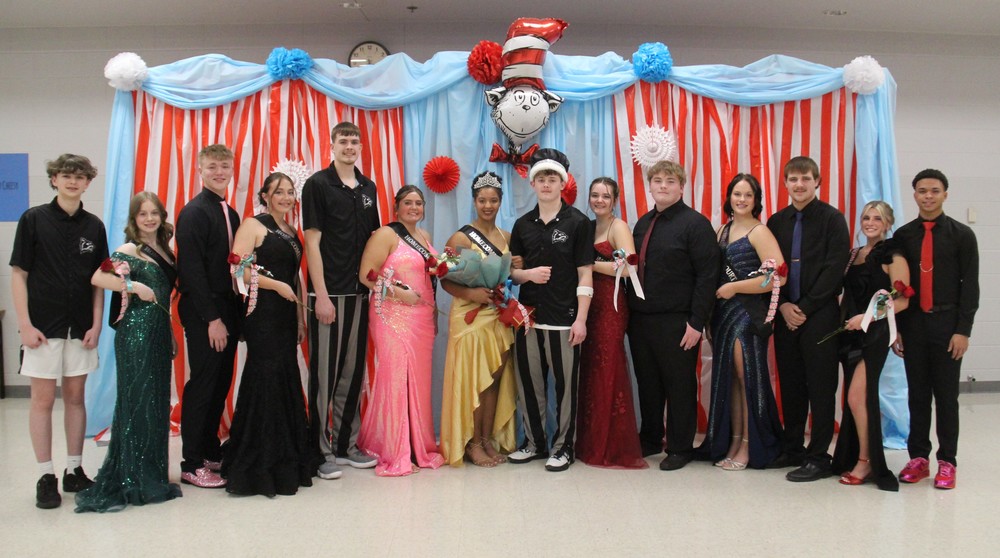group of 14 Homecoming Court members standing in front of a Dr. Seuss themed backdrop
