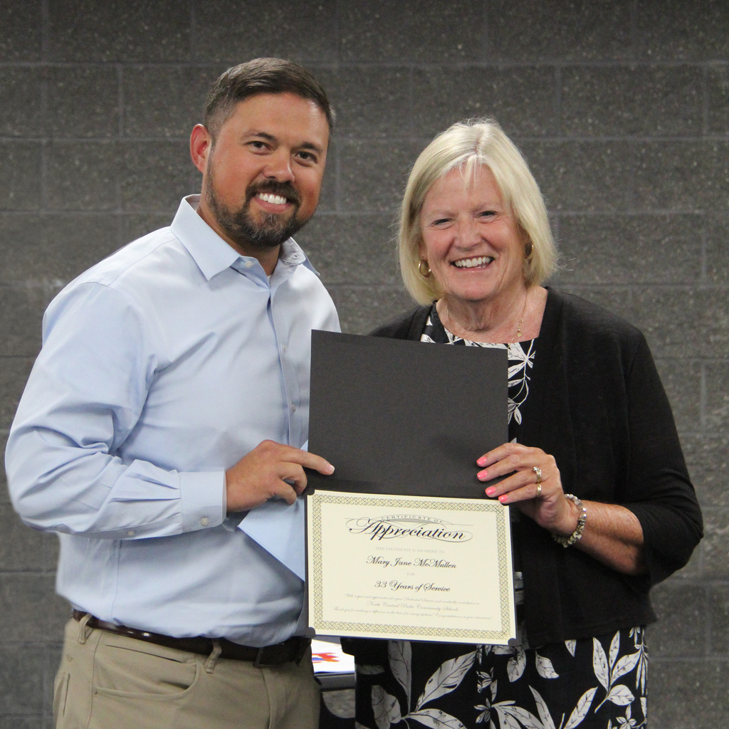 Zachary Clapp and Jane McMullen with retirement Certificate.