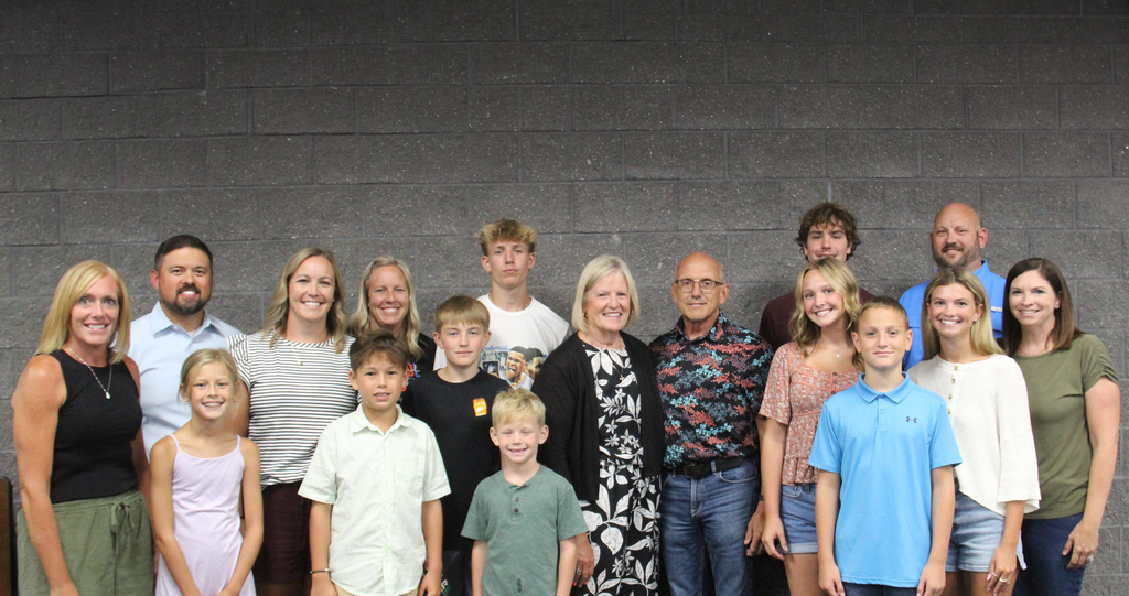 Jane McMullen pictured with her family at her retirement celebration.