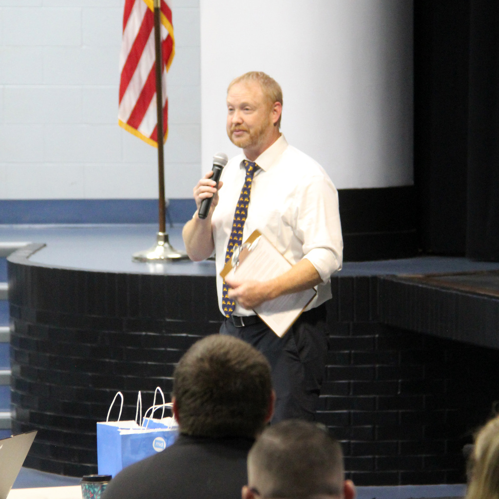 Superintendent speaks to the staff during the back to school kickoff meeting.