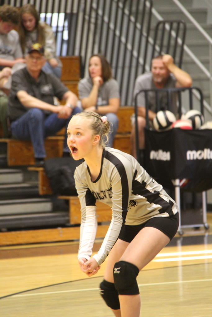 Volleyball Player in stance, waiting to bump the ball.