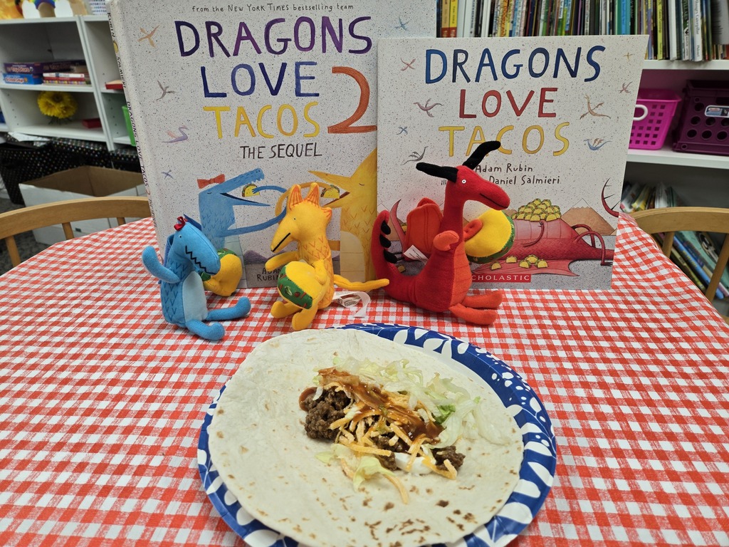 Dragons Love Tacos 2 Books with 3 stuffed dragons and a soft taco on plate.