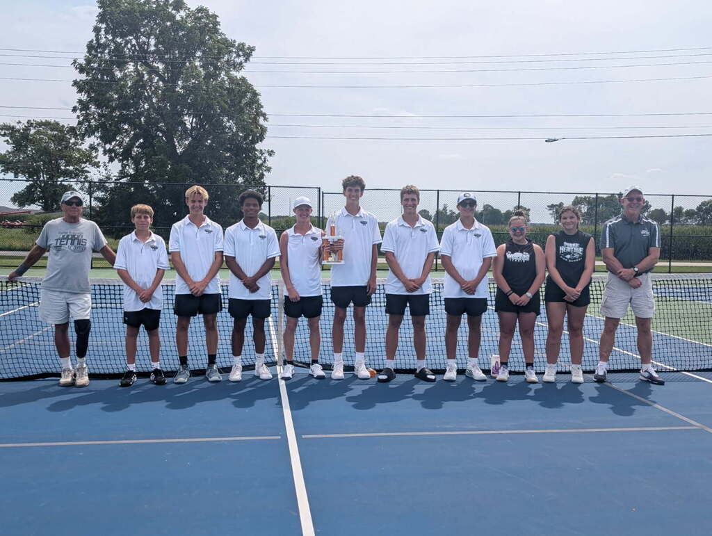 HS Boys Tennis team lined up in front of the tennis net after an amazing win athe the North Montgomery Invitational Tournament Saturday!