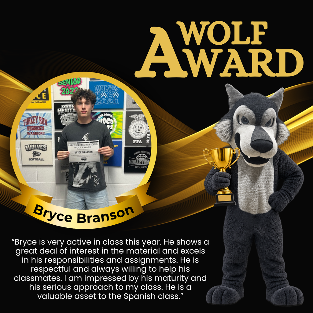 Photo of Bryce holding his Wolf Award certificate in front of a wall decorated with Parke Heritage and school activity signs.