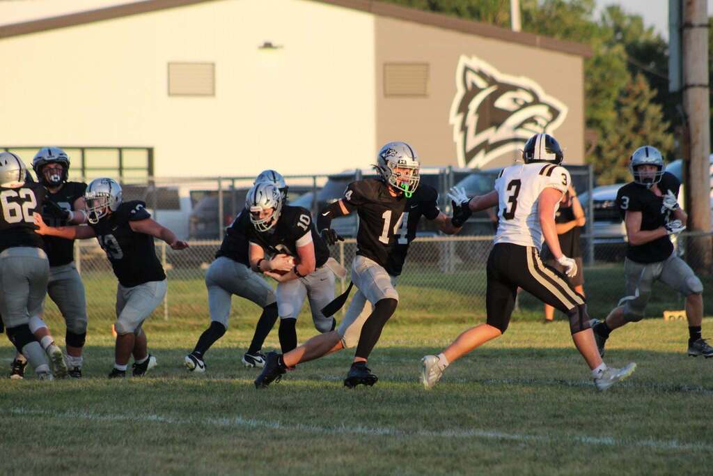 Parke Heritage players block defenders as a ball carrier advances upfield.