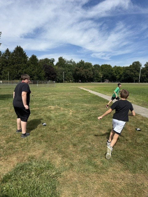 Students playing a game outdoors.