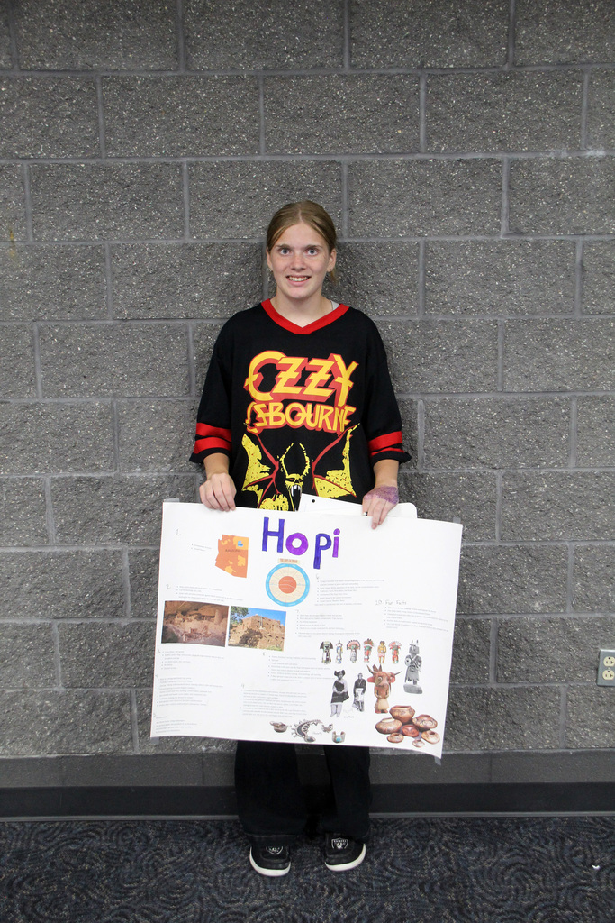 8th grade social study students have been learning about Pre-Columbian Native American groups. Student is holding her poster about the Hopi Tribe.