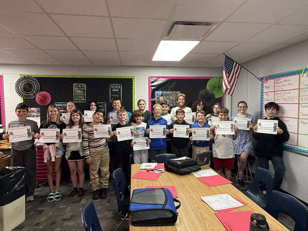 Students from Mrs. Lorenze's 6th Grade College and Careers class pose for a photo with their certificates from Organization Boot Camp.