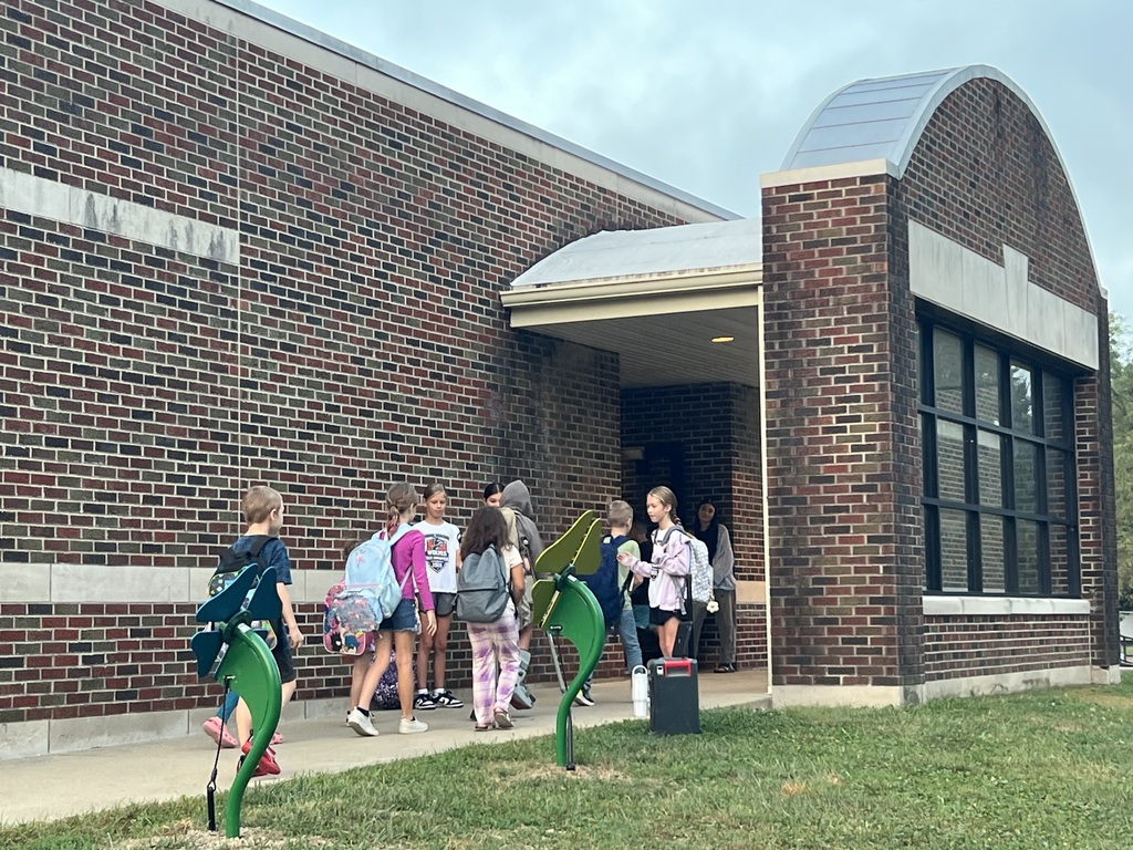 3 RES Student council members high five the elementary students as they walk into school for High Five Friday!