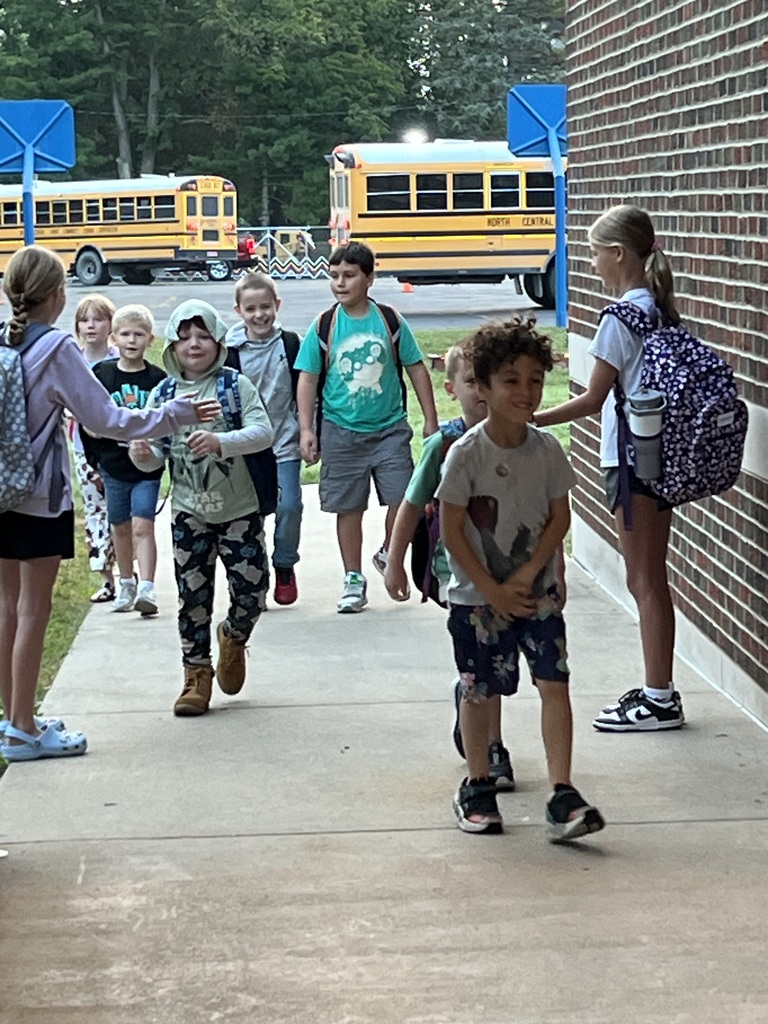 2 RES Student council members high five the elementary students as they walk into school for High Five Friday!