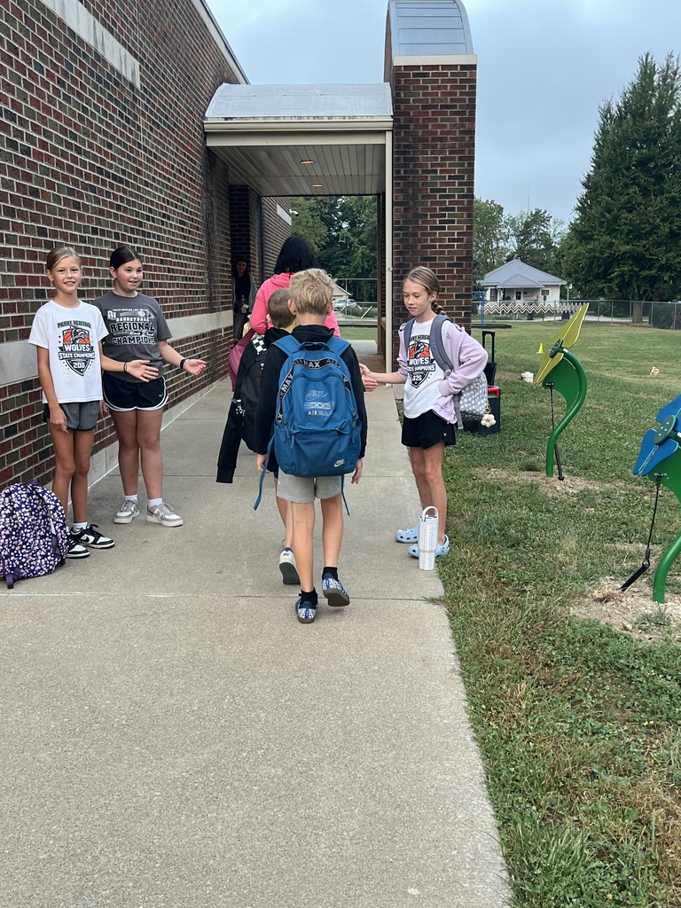 3 RES Student council members high five the elementary students as they walk into school for High Five Friday!