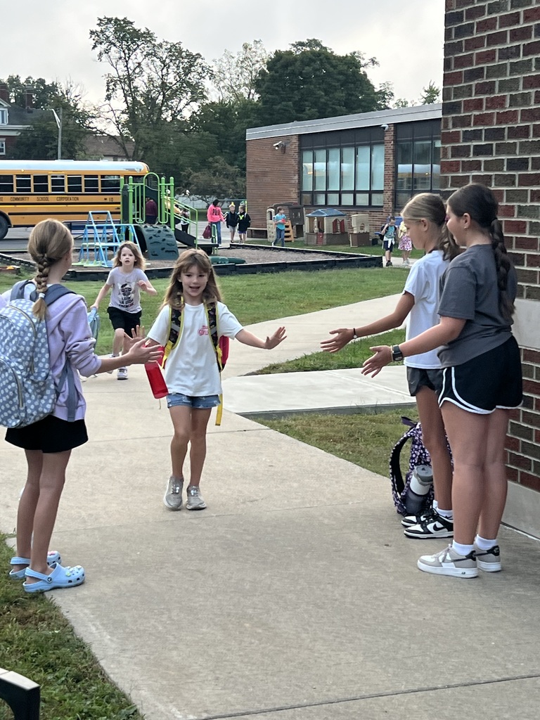 3 RES Student council members high five the elementary students as they walk into school for High Five Friday!