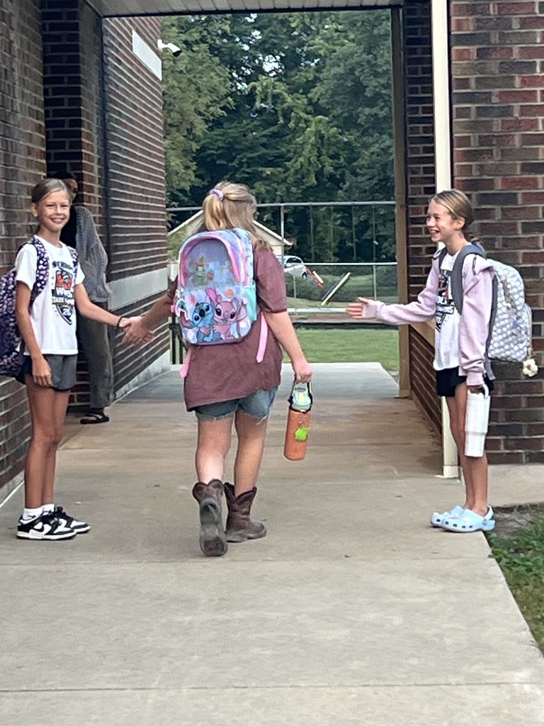 2 RES Student council members high five the elementary students as they walk into school for High Five Friday!