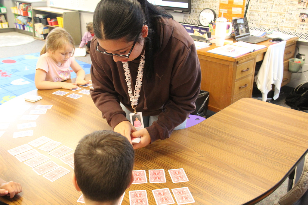 Education Professions student working with a student on math skills.