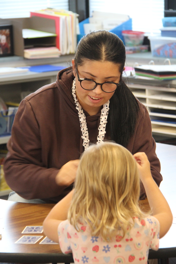 Education Professions student working with a student on math skills.
