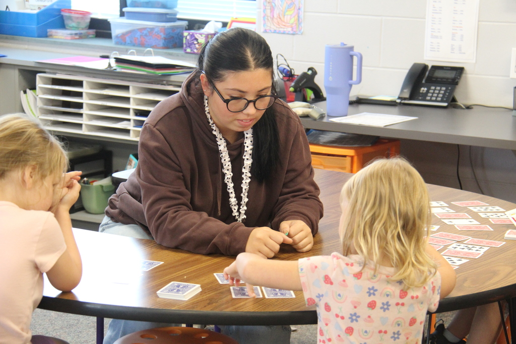 Education Professions student working with a student on math skills. 
