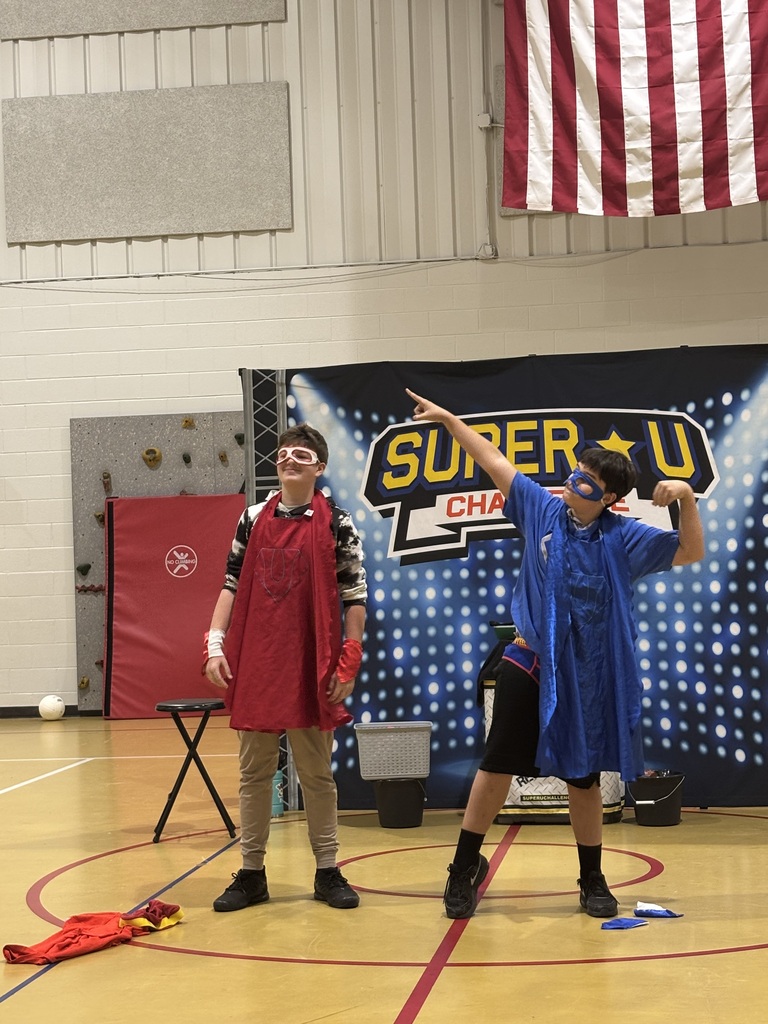 2 Students posing as a super hero at the Anti Bullying convocation.