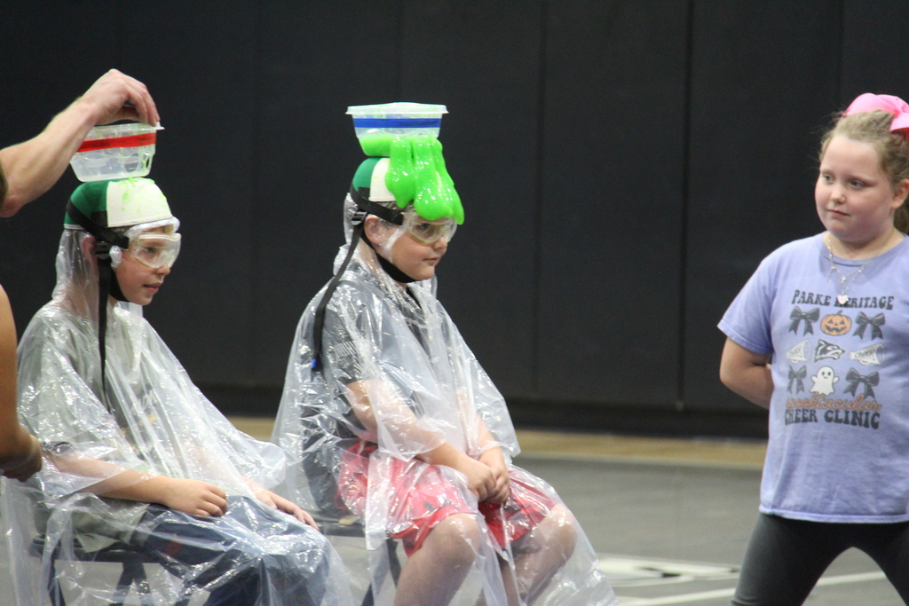Students sitting with slime running down his face. 