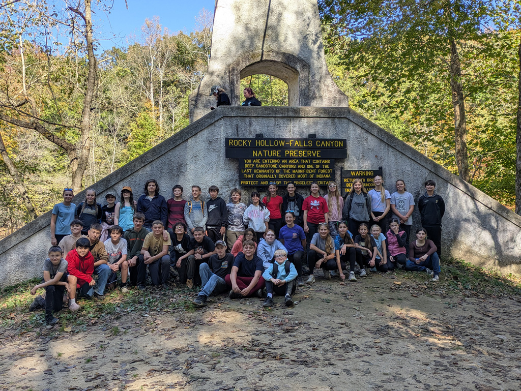 Group Photo in front of Rocky Hollow-Falls Canyon sign.