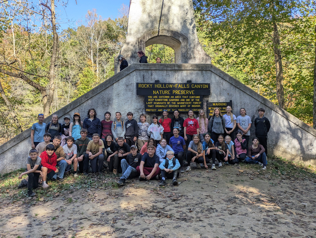 Group Photo in front of Rocky Hollow-Falls Canyon sign.