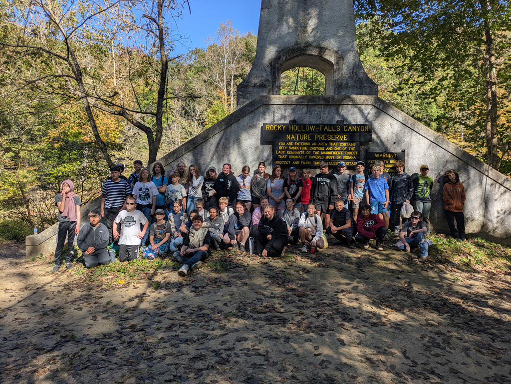 Group Photo in front of Rocky Hollow-Falls Canyon sign.