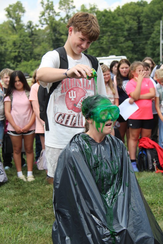 a student sliming a teacher