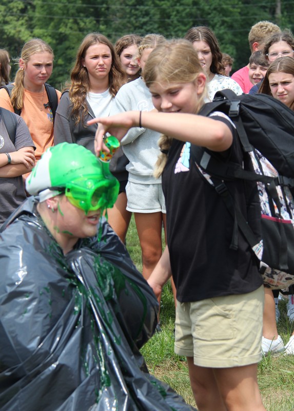 a student sliming a teacher