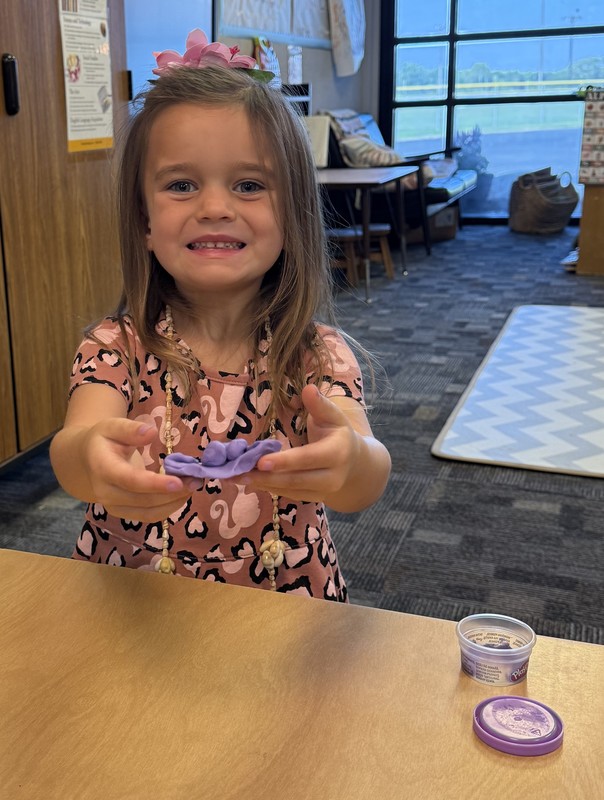 student playing with Play-Doh