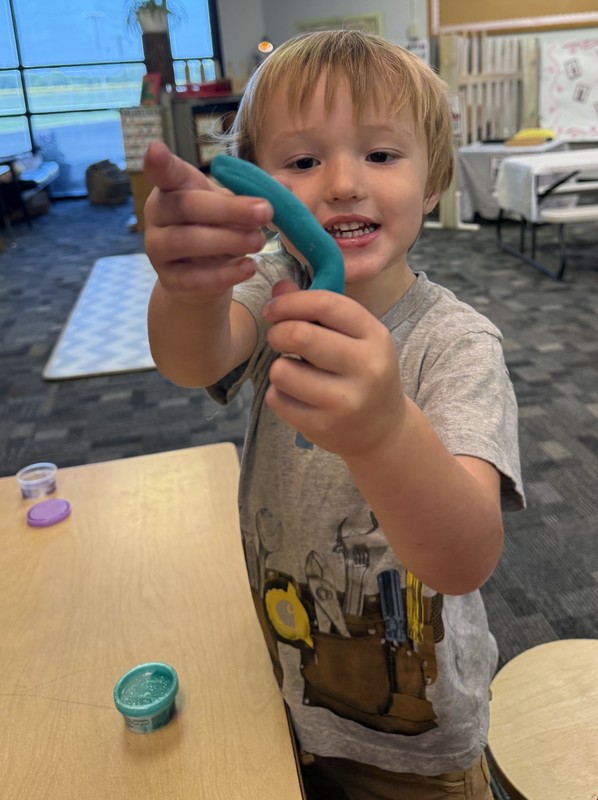 student playing with Play-Doh