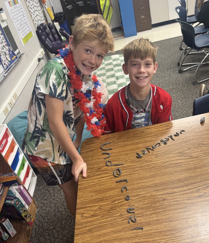 two students making words with Play-Doh