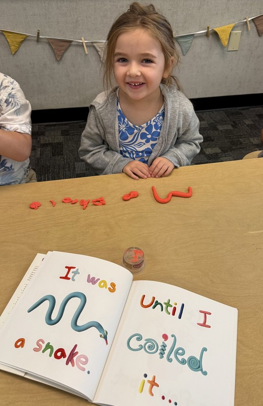 student playing with Play-Doh