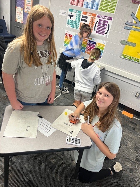 two students working on their math review