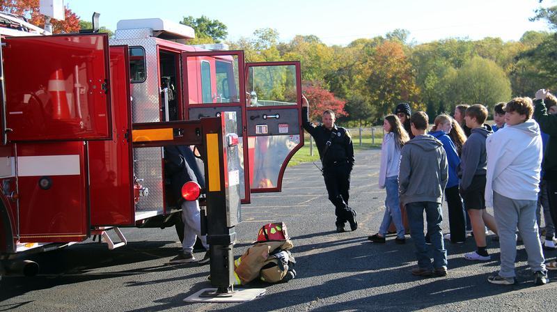 fire fighter talking to students