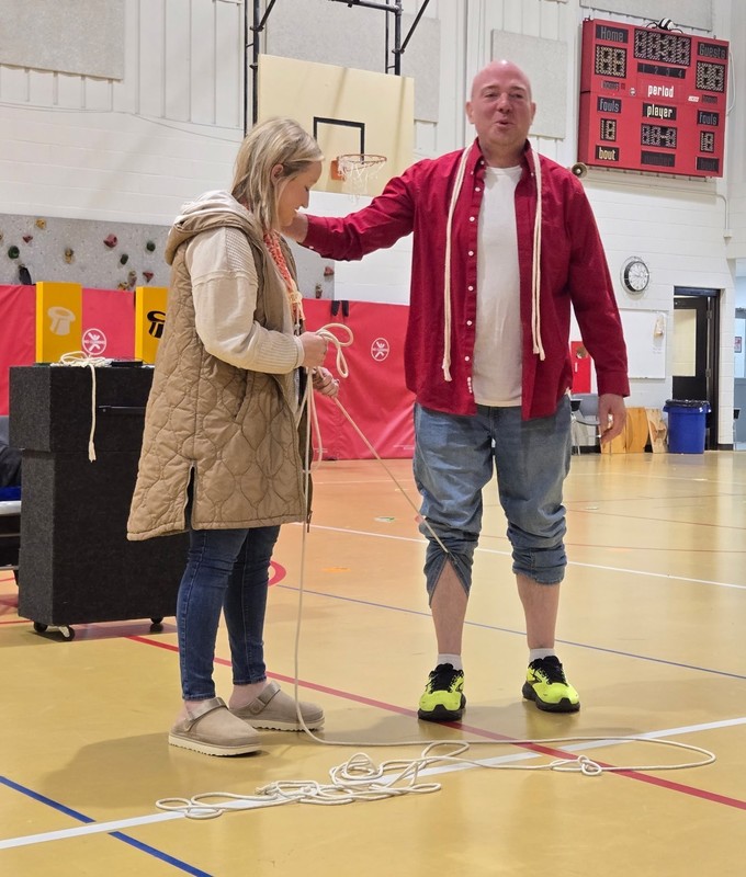 a teacher standing with a magician