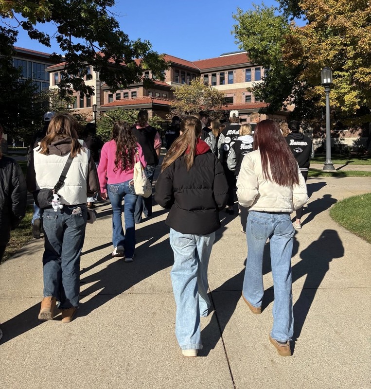 students walking on a sidewalk on the Purdue campus