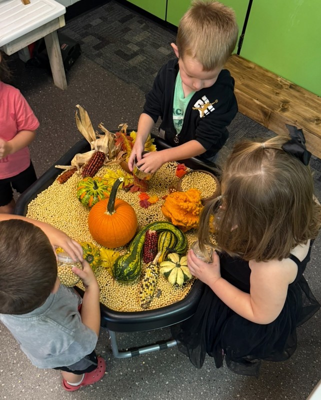 preschool students doing a fall craft