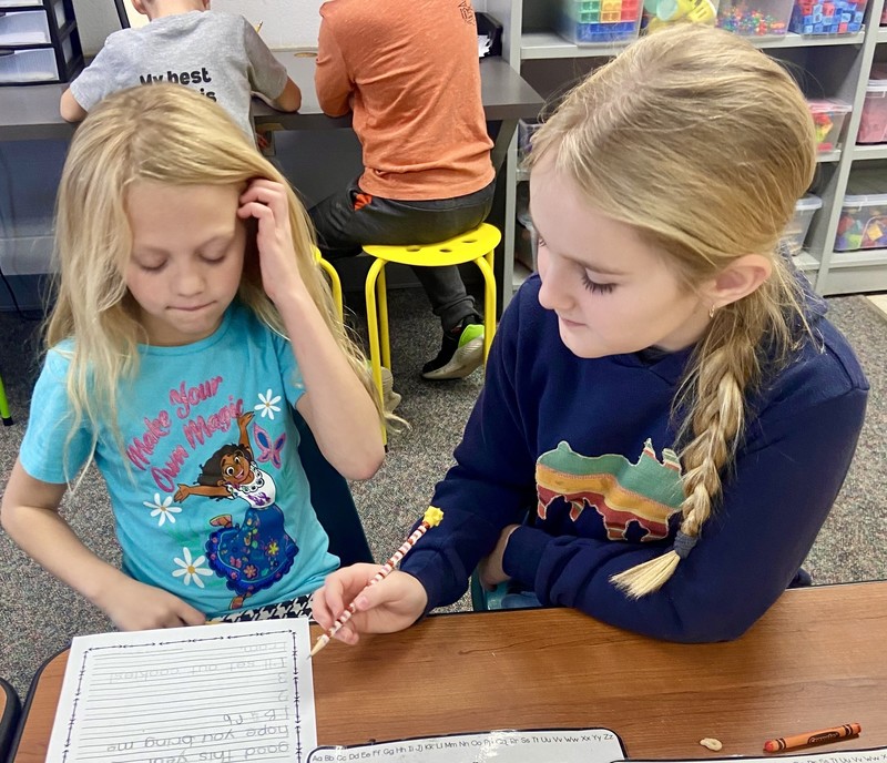 two girls writing a letter to Santa