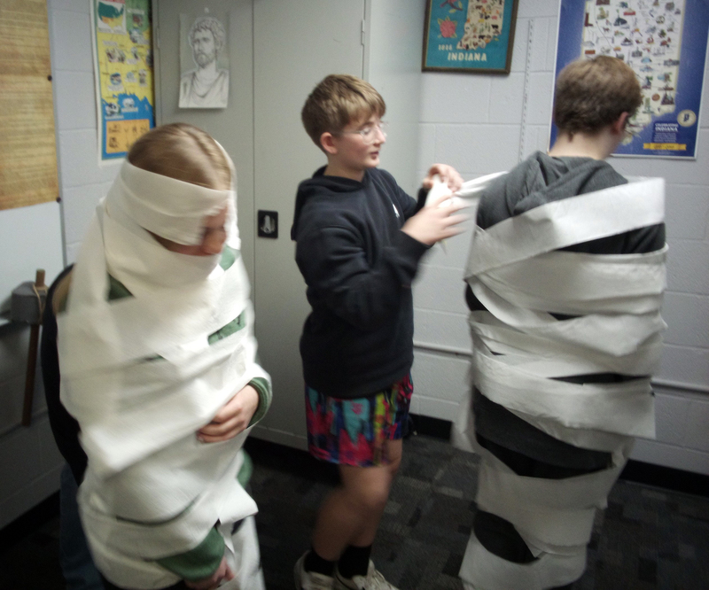 students being wrapped in toilet paper